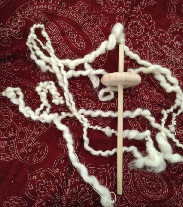 White Wool Art Yarn spun on a drop spindle